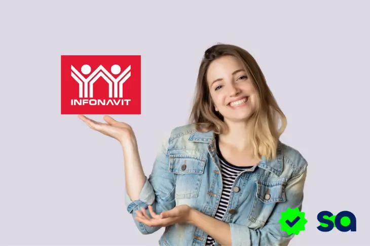 Mujer sonriendo y señalando el logo de Infonavit con fondo claro.